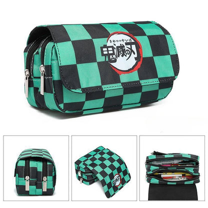 Demon Slayer canvas pencil case with double zipper, inspired by the Kimetsu No Yaiba universe. It offers a large storage space for pens, pencils, and other supplies, while adding a kawaii touch to your daily life. 